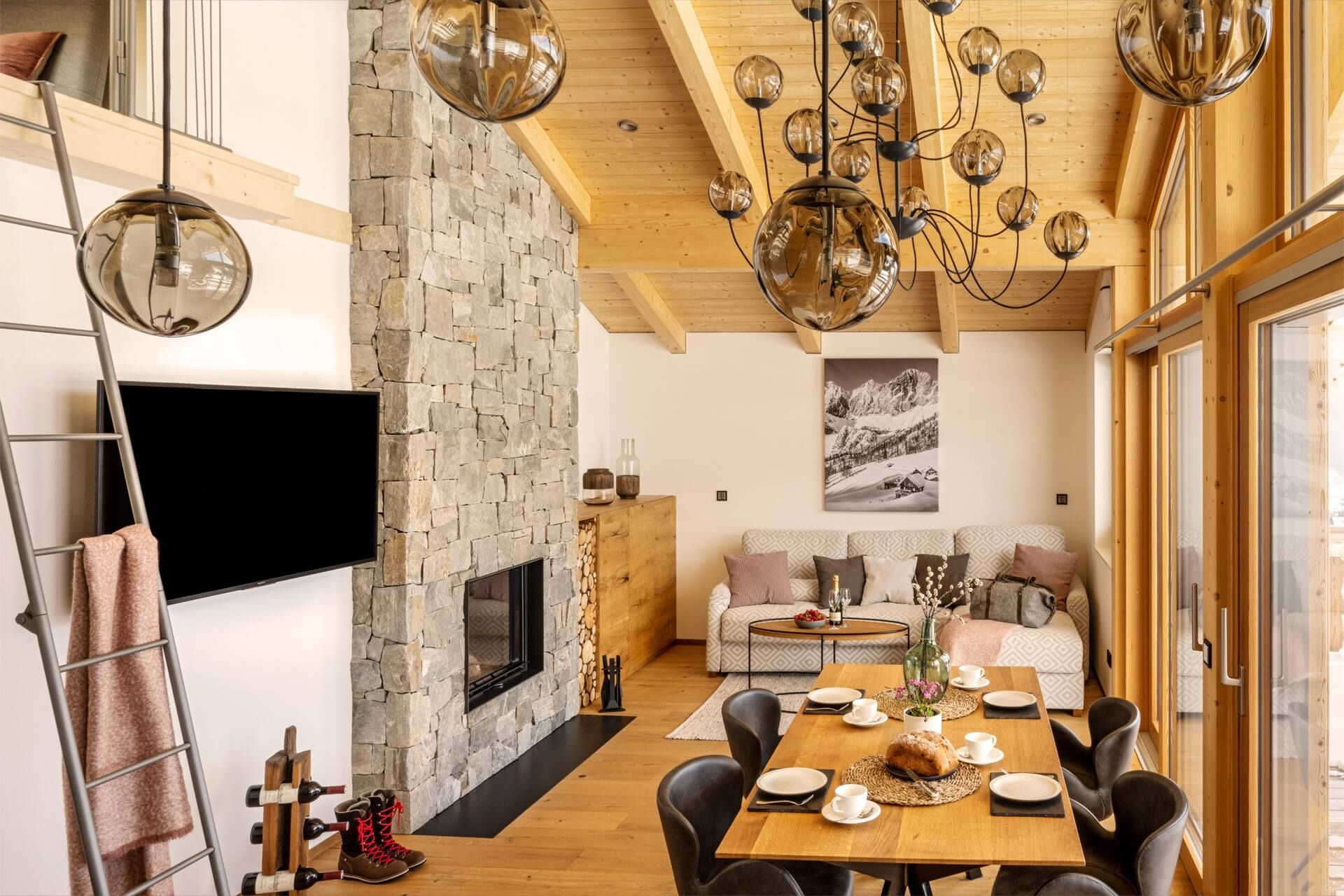 Open-plan living with a stone fireplace