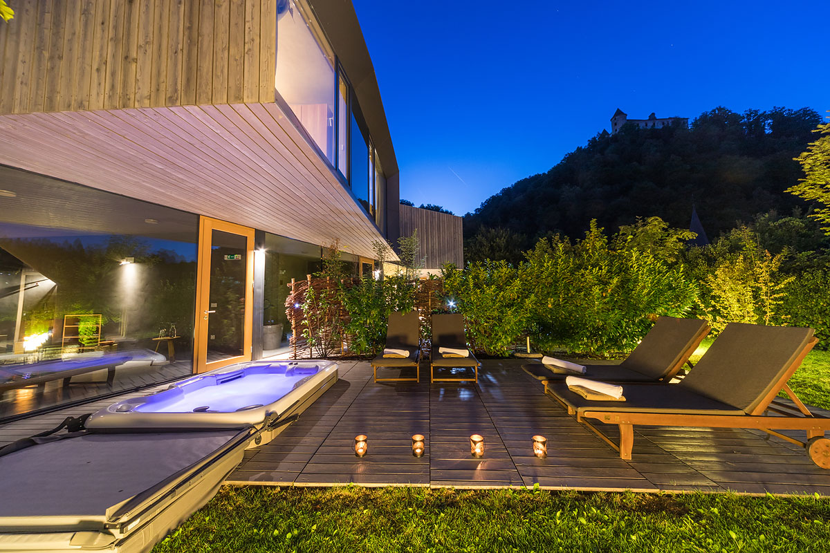 Terrace and outdoor hot tub at dusk